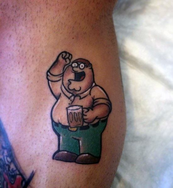 Tattoo of Peter Griffin from Family Guy, cheerfully raising his fist while holding a beer mug labeled "DUFF," wearing his classic outfit.