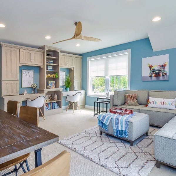 Bright multipurpose room with study area, sectional sofa, and modern decor.