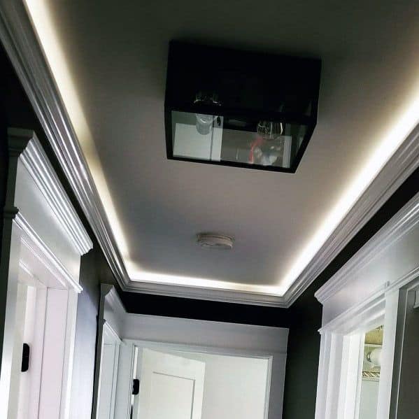 Modern hallway with sleek crown molding lighting, adding a touch of elegance to the space