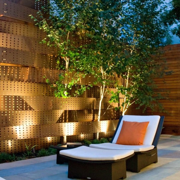 curved metal privacy fence with wicker seat