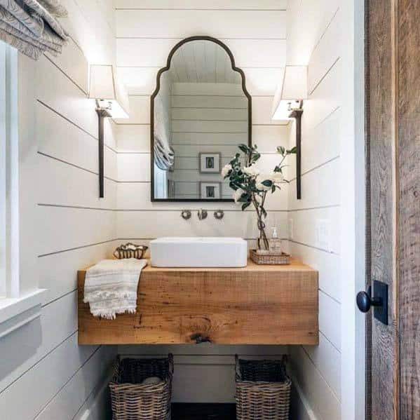 white shiplap bathroom wood vanity white sink wicker baskets wall mirror