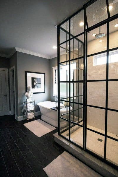 luxury modern bathroom shower with square window wall free standing bathtub black tile flooring