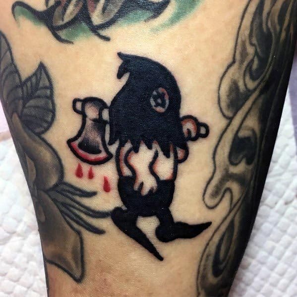 Minimalist executioner tattoo with a ragged hooded figure carrying a bloodied axe, featuring bold black ink and simple details.