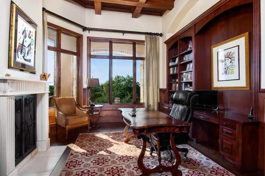 executive home office vintage wood desk accent chair fireplace 