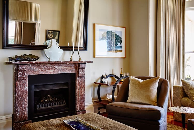 rustic style fireplace and mantel in elegant living room