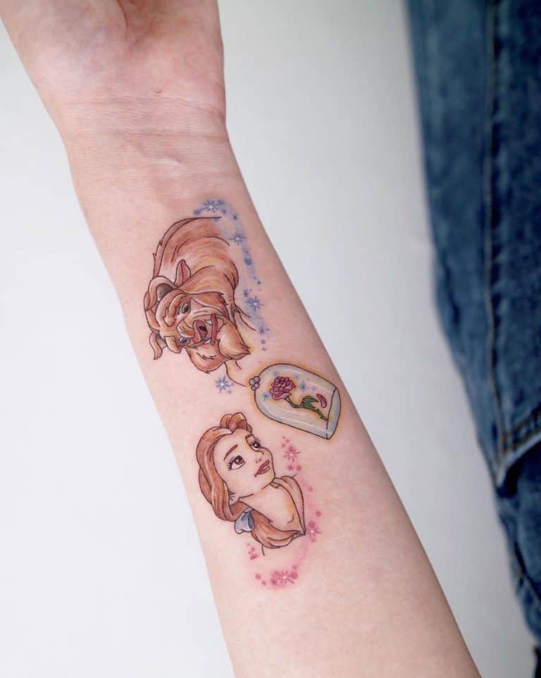 Delicate Beauty and the Beast tattoo featuring Belle, the Beast, and the enchanted rose, surrounded by soft floral accents.