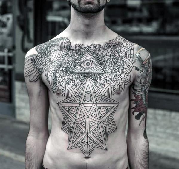 Man with intricate geometric tattoos covering his chest and arms