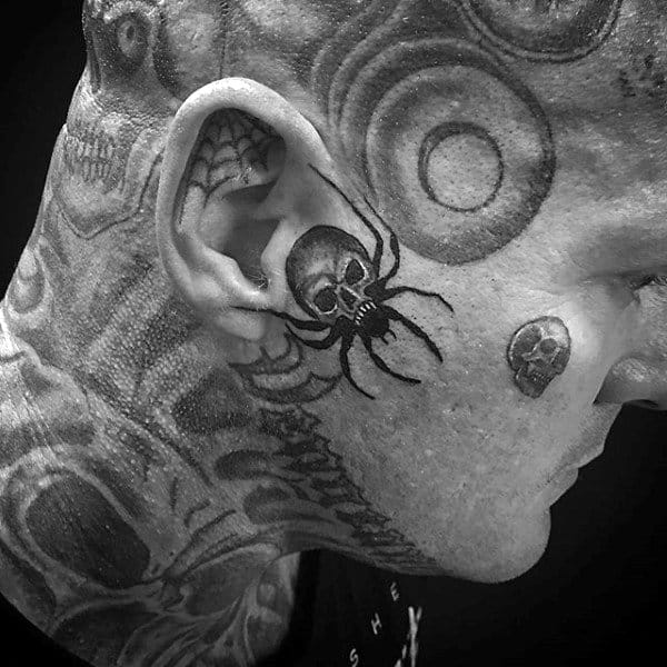 Face Tattoo Of Spider And Skull On Man