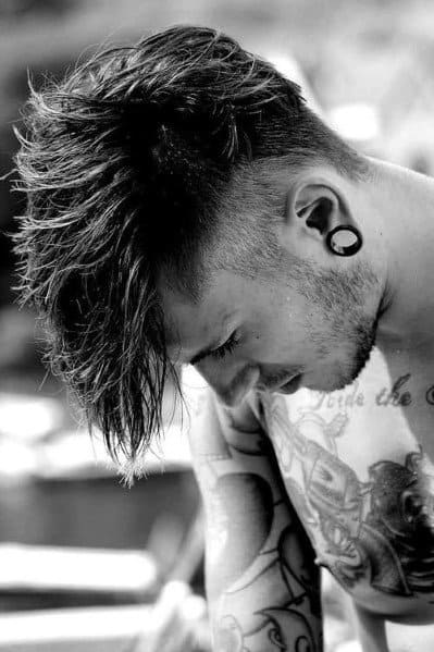 Messy, textured top with a high fade on the sides