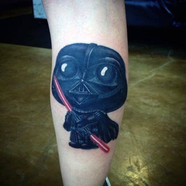 Tattoo of Stewie Griffin from Family Guy dressed as Darth Vader in a Funko Pop-style design, holding a red lightsaber with a glossy finish.