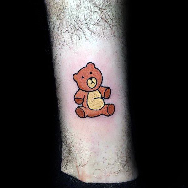 Tattoo of Rupert, Stewie Griffin’s beloved teddy bear from Family Guy, depicted in a simple and clean design with warm brown tones.