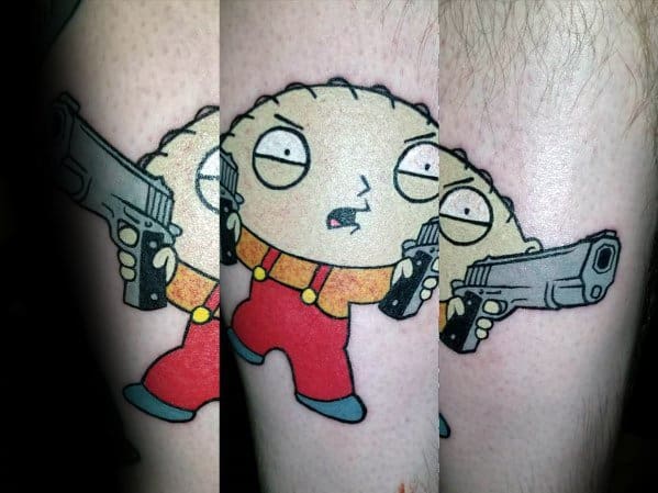 Tattoo of Stewie Griffin from Family Guy holding a handgun in each hand, wearing his classic red overalls and yellow shirt with a mischievous expression.