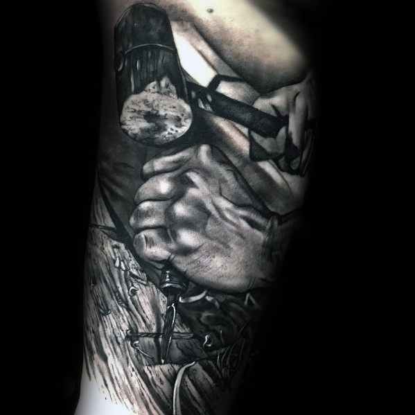 Realistic black and gray tattoo of hands using a mallet and chisel, symbolizing craftsmanship, precision, and dedication to woodworking.