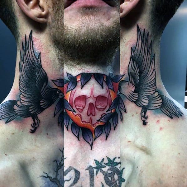 Throat tattoo featuring a red skull encircled by dark leaves, flanked by two detailed black ravens in flight for a bold, gothic look