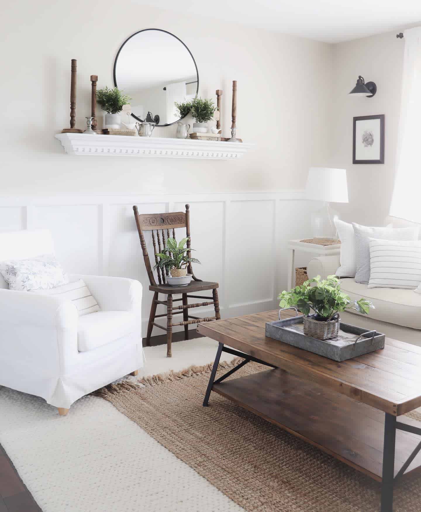 white farmhouse living room wall shelf with candlesticks and mirror pot plants rocking chair wood coffee table 