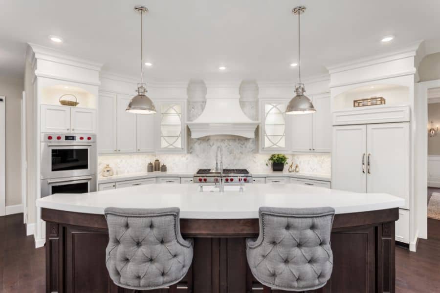 ornate white range hood in farmhouse kitchen 