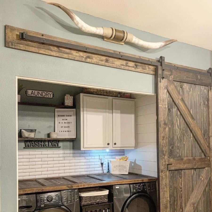 rustic farmhouse laundry room sliding barn door