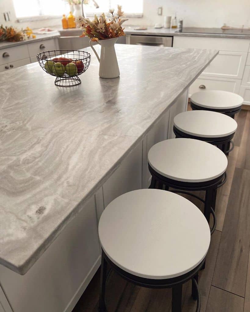 granite countertop on kitchen island with stools
