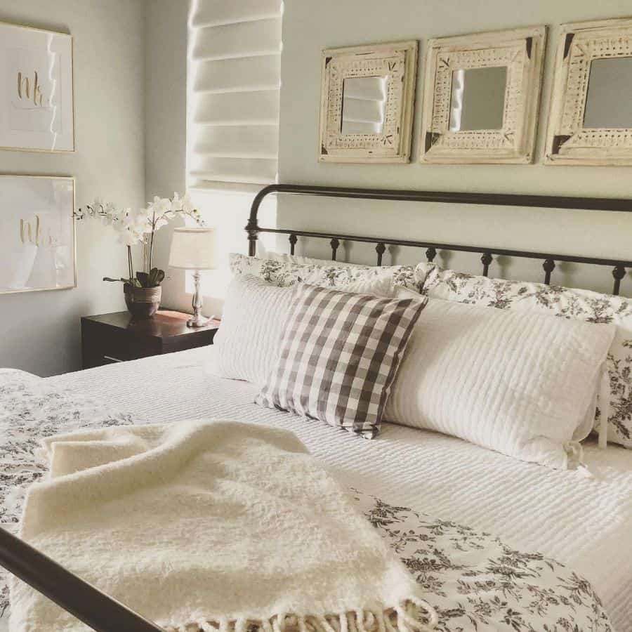 farmhouse small master bedroom with cast iron bed frame