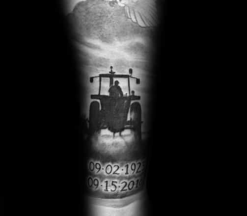 Black and gray memorial tattoo of a farmer driving a tractor into the horizon, with dates below and a dove above in the sky.
