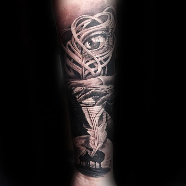 Feather Piano Player Tattoo On Gentlemans Forearm