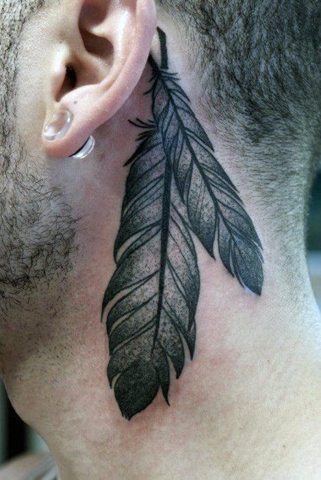 Feather Tattoo On Back Of Man's Neck