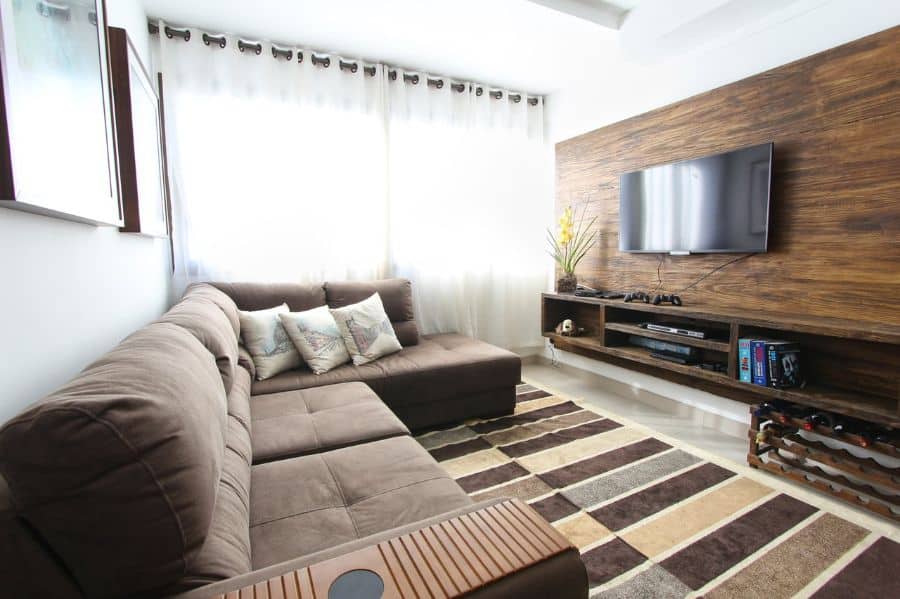 small apartment living room with wood feature wall