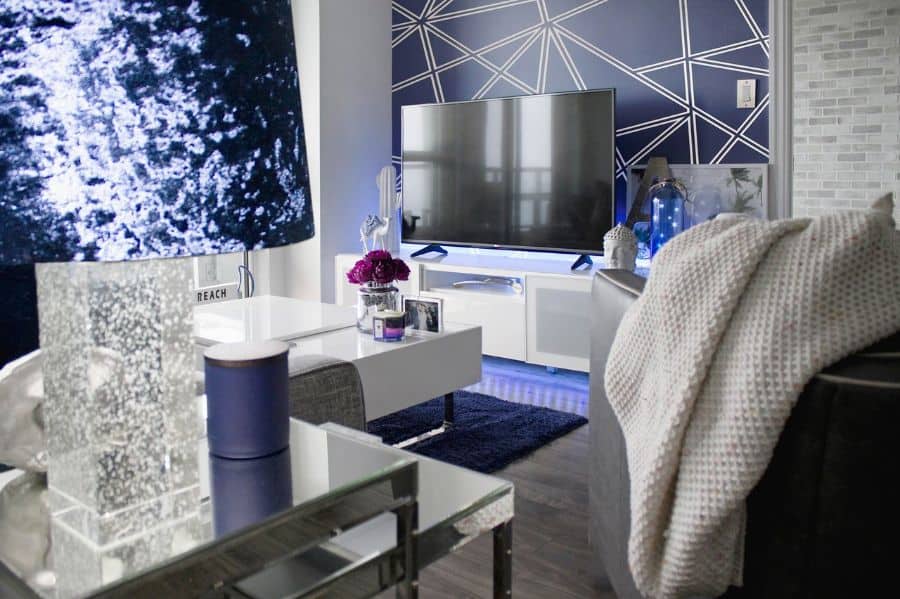 luxury living room with blue and white pattern accent wall