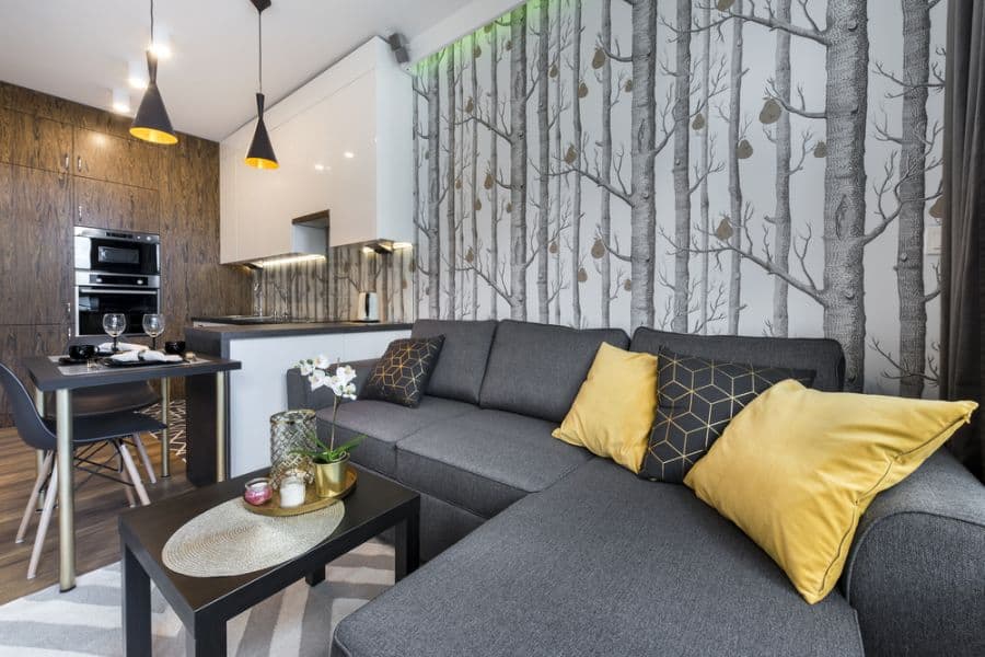 tree wallpaper accent wall in open plant apartment kitchen living space