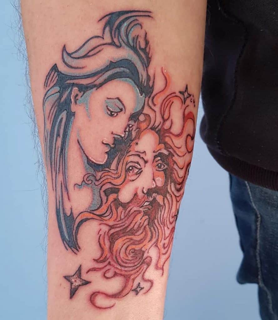 Tattoo of a stylized sun and moon on a forearm, with the moon as a serene female face and the sun as a fiery bearded figure.