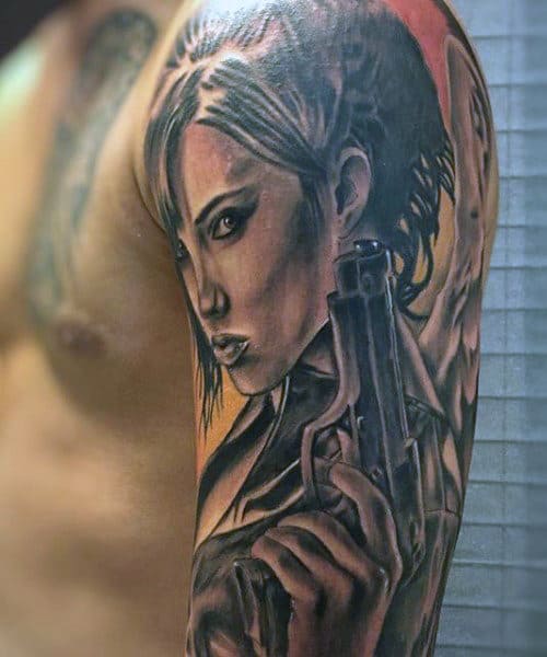 Female Men's Tattoo Gun On Upper Arm