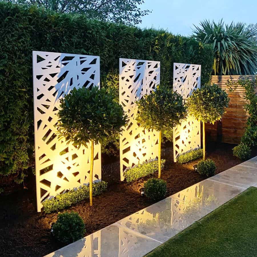 modern backyard gray slate path white dividers with lights