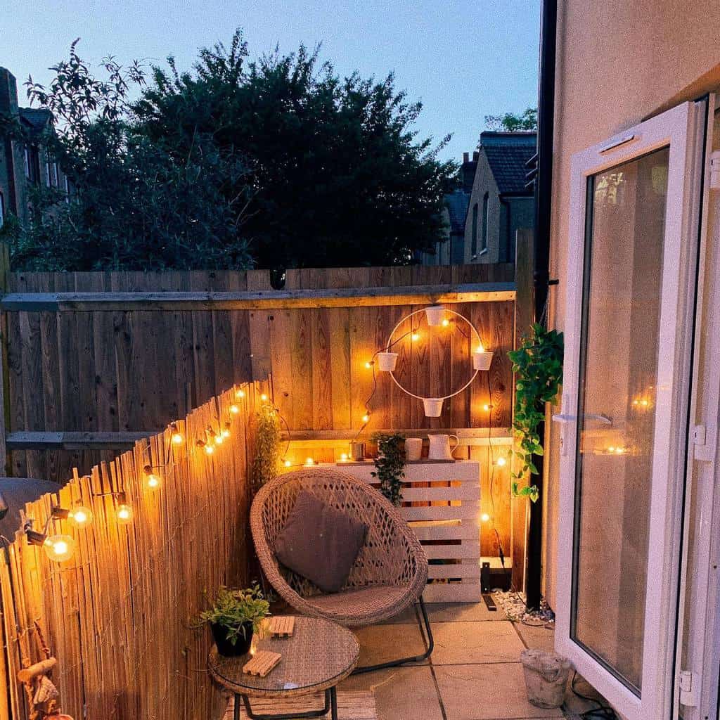 small narrow backyard patio with bamboo privacy fence 