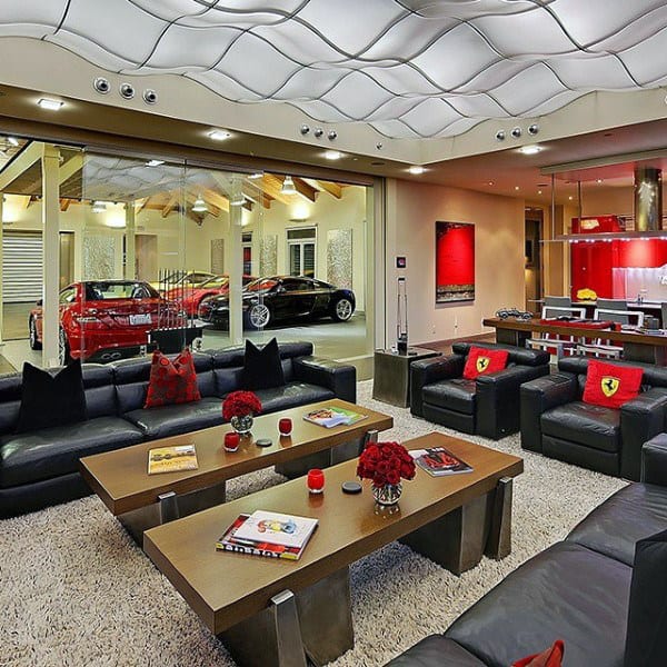 Ferrari-themed lounge with luxury seating, wave ceiling, and glass wall showcasing exotic cars.