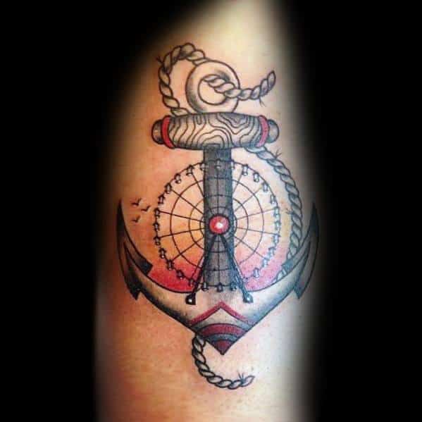 Unique Ferris wheel and anchor tattoo with bold black and red details, featuring a rope and wood texture for a nautical and adventurous theme.
