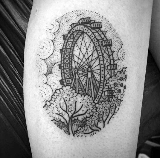 Detailed Ferris wheel tattoo with fine linework and dot shading, surrounded by trees and swirling clouds for a whimsical and artistic look.