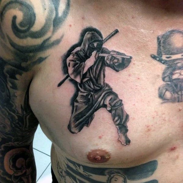 Fighting Ninja Black Ink Shaded Male Upper Chest Tattoos