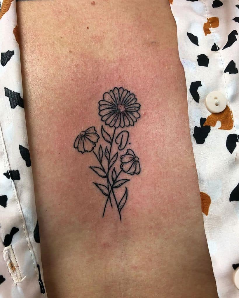 Sternum tattoo black and grey fine line daisy bouquet