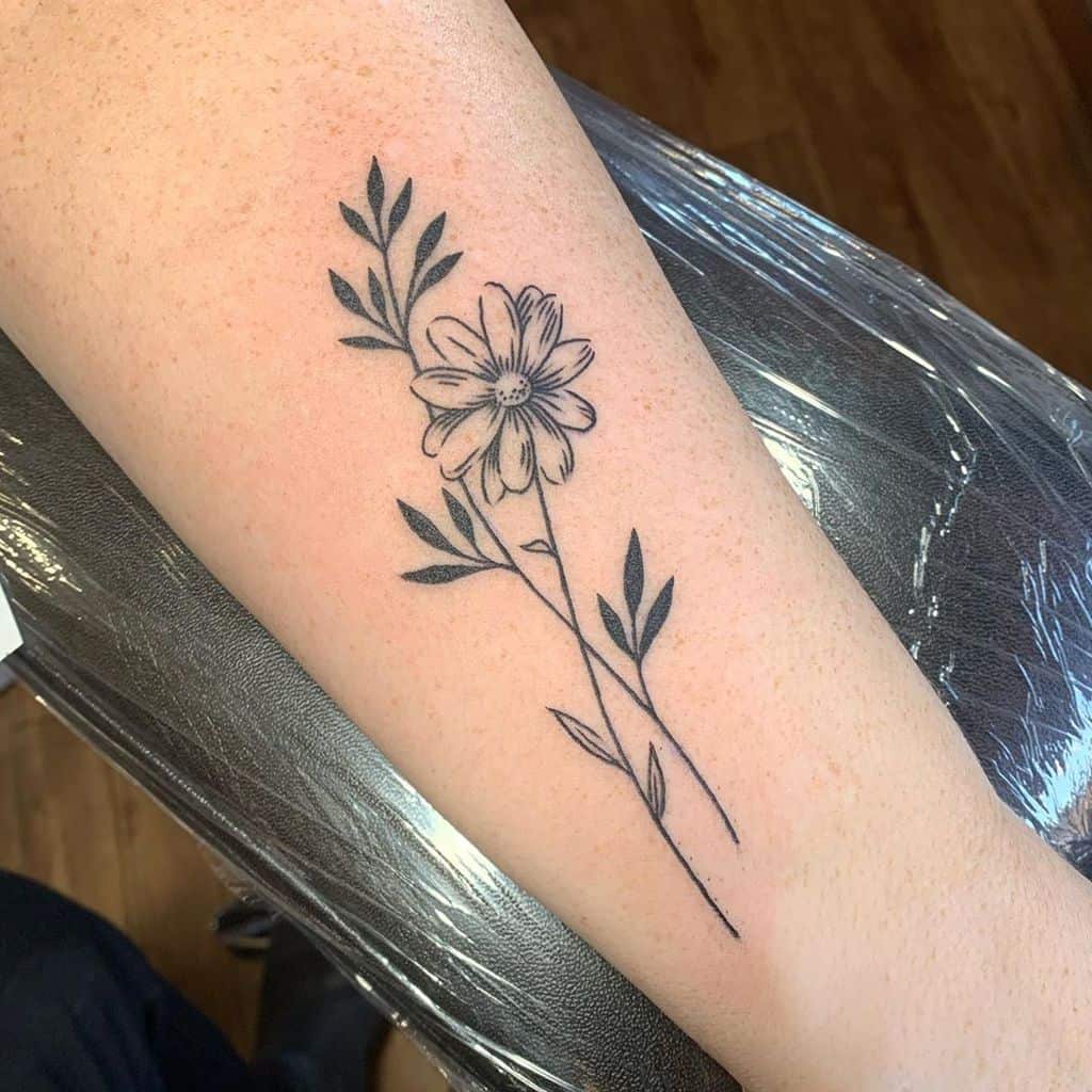 Forearm tattoo black and grey fine line illustrative daisy