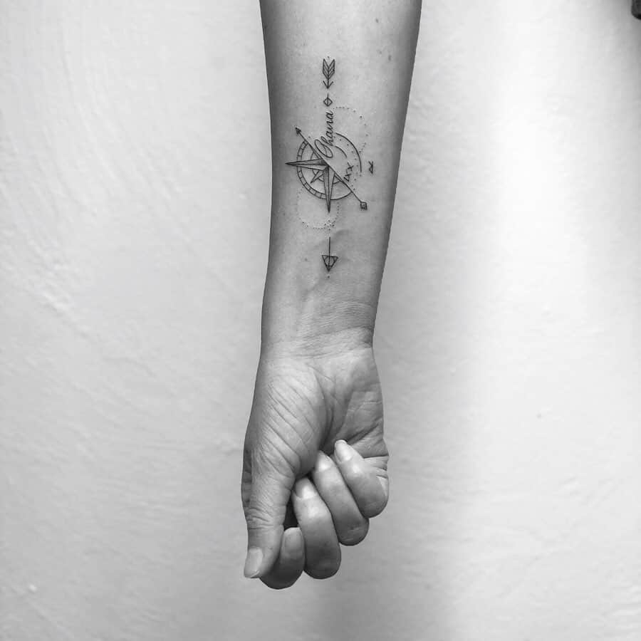 Minimalist tattoo featuring a compass with the word 'Ohana' above it, symbolizing family as a guiding force and direction.