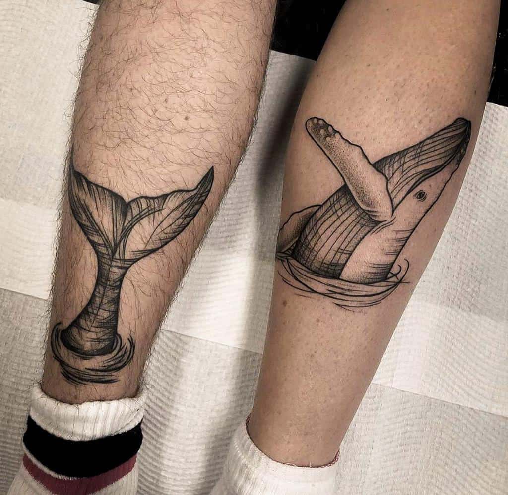 Matching black and gray whale tattoos, one featuring a breaching whale, the other showing a whale's tail emerging from ocean