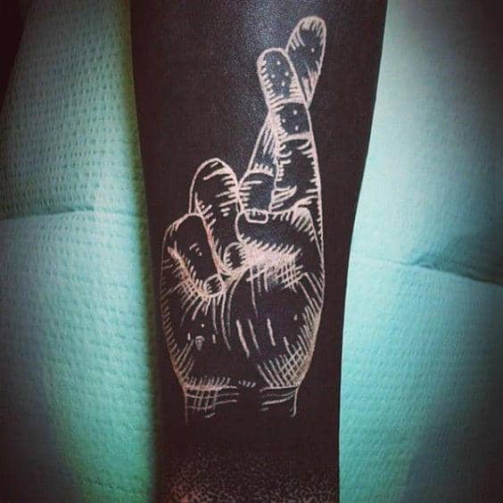 Fingers crossed mens white ink tattoo over black
