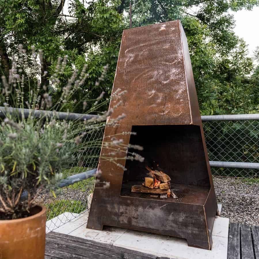 large copper fire pit metal wire fence