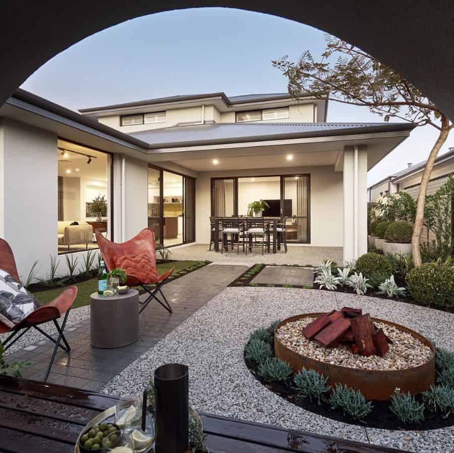 copper fire pit backyard gravel patio paved bath red outdoor chairs