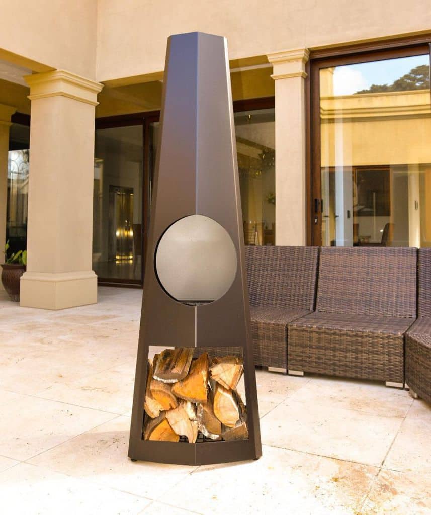 abstract fire pit backyard patio brown wicker furniture