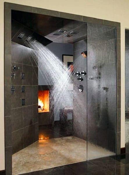 Luxurious bathroom with a sleek dual shower and a fireplace in the background