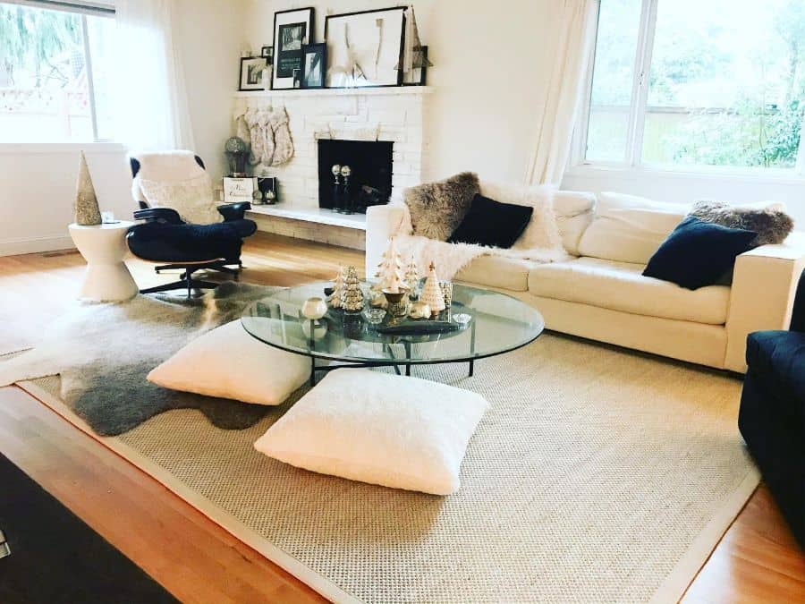 white living room fireplace sofa glass coffee table