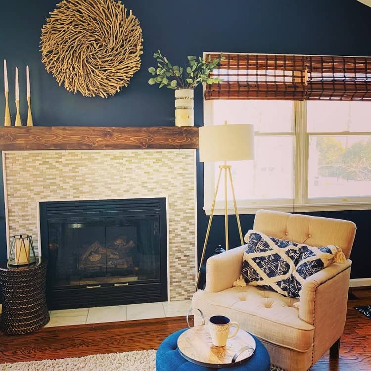 accent blue wall in living room with mosaic tile fireplace