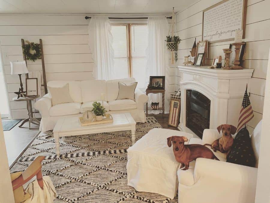 modern farmhouse living room shiplap walls fireplace white couches