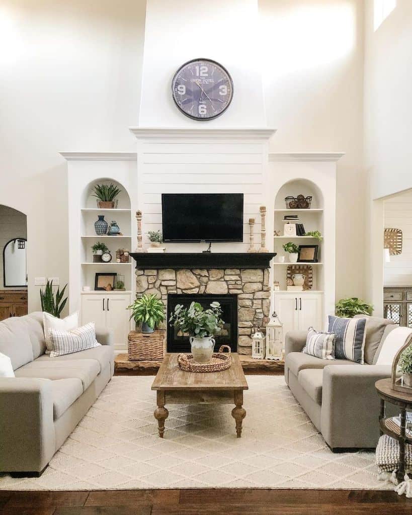 white shiplap stone fireplace gray couch modern rustic living room wall mounted tv recessed shelves